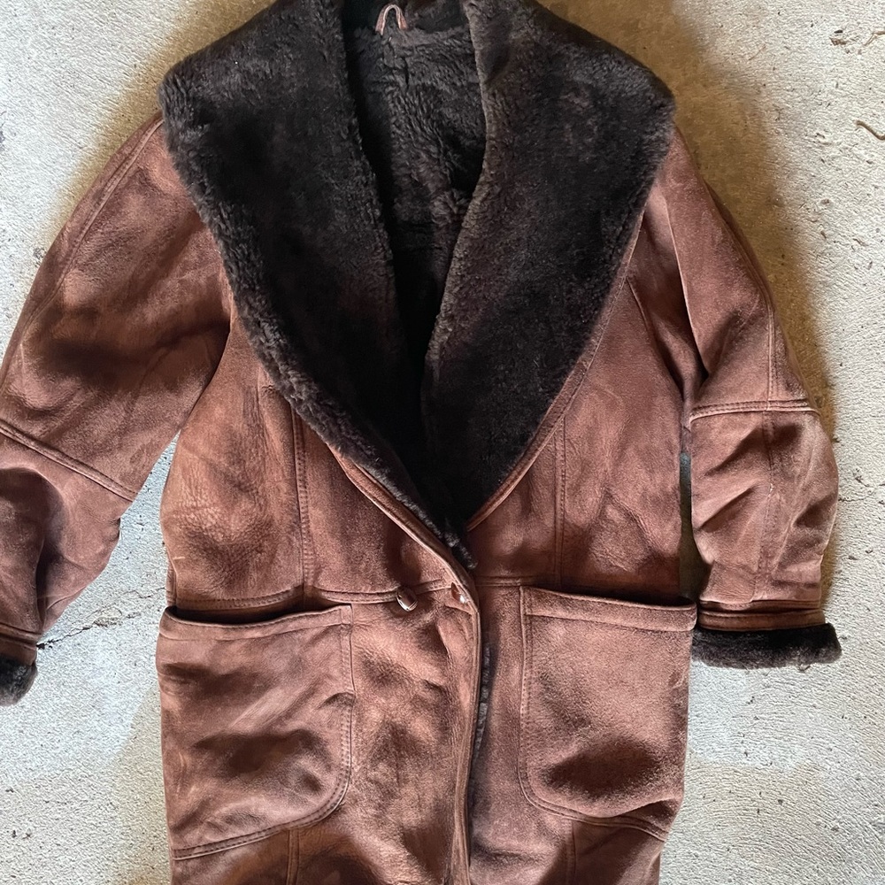 Chocolate brown shearling. Size small but runs big. Very warm.